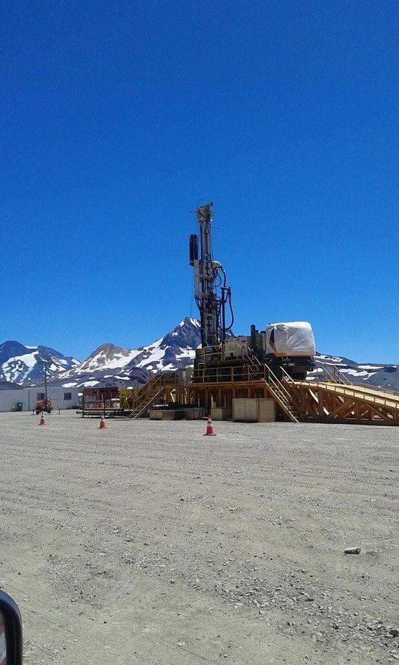 Rig set up against snow-capped Andes peaks