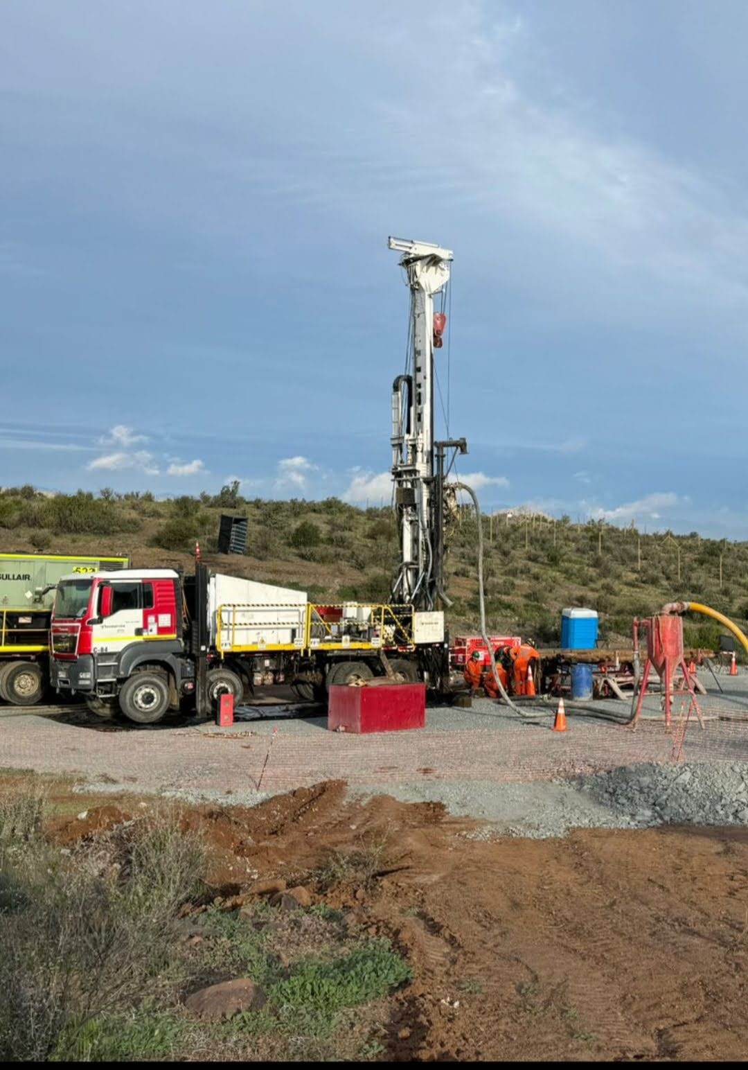 Crew drilling with RC cyclone and air package on site